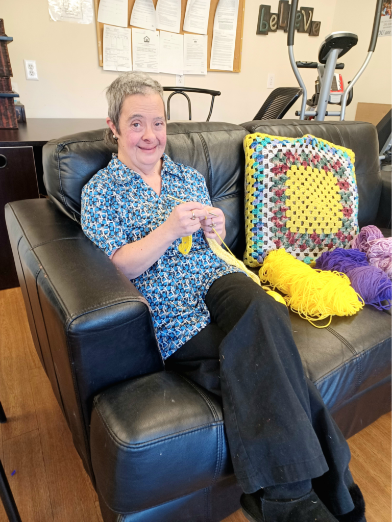 Susanna crocheting in VOA Southeast Clubhouse