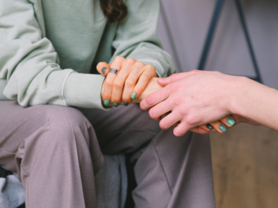 two people holding hands