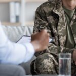Veteran talking with another person about housing support.